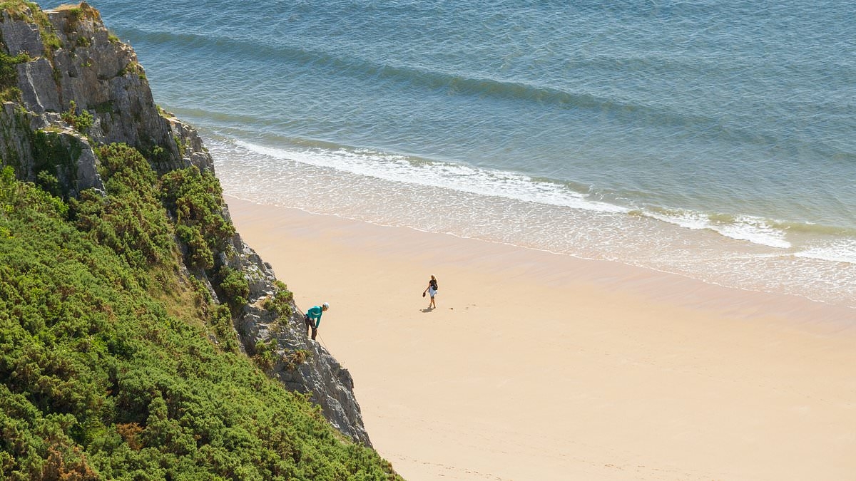 Man, 50, dies at British beauty spot after getting into trouble swimming in the sea