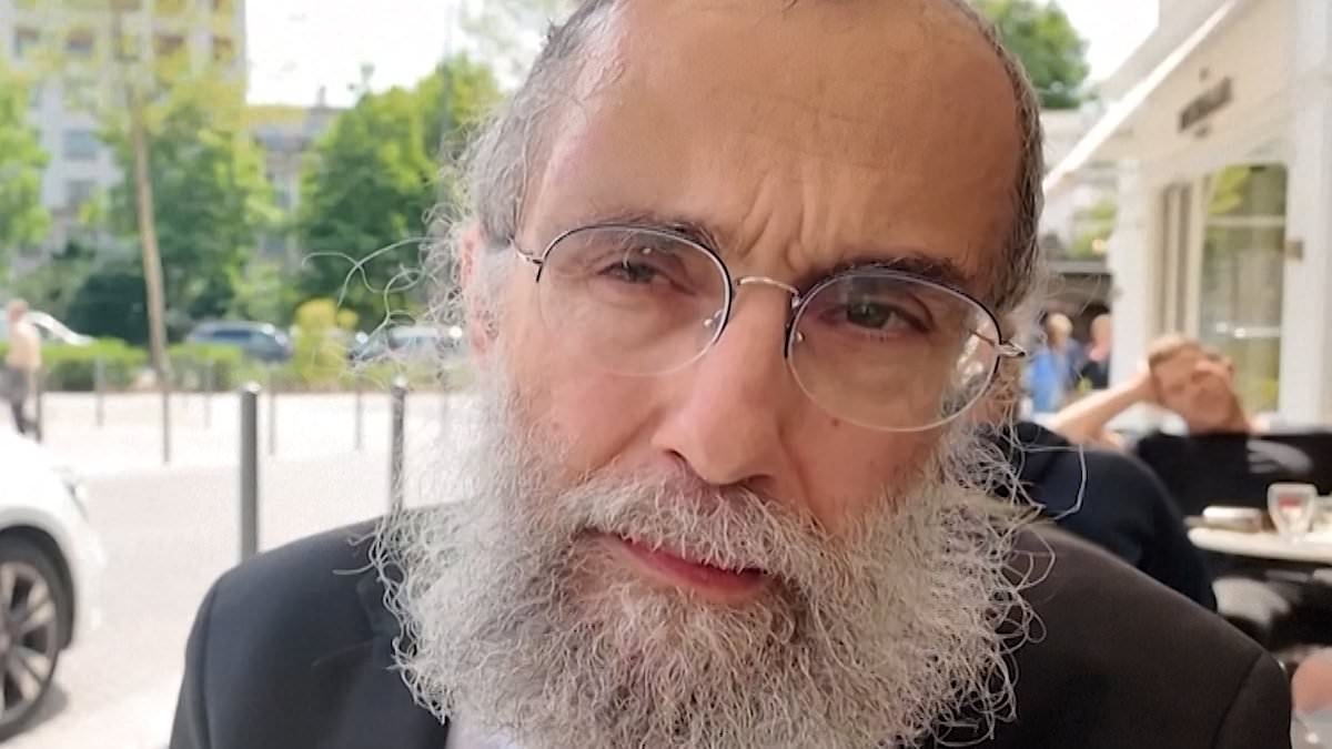 Moment heroic bystanders step in to detain 'antisemitic' thug who attacked Rabbi at café in wealthy Paris suburb