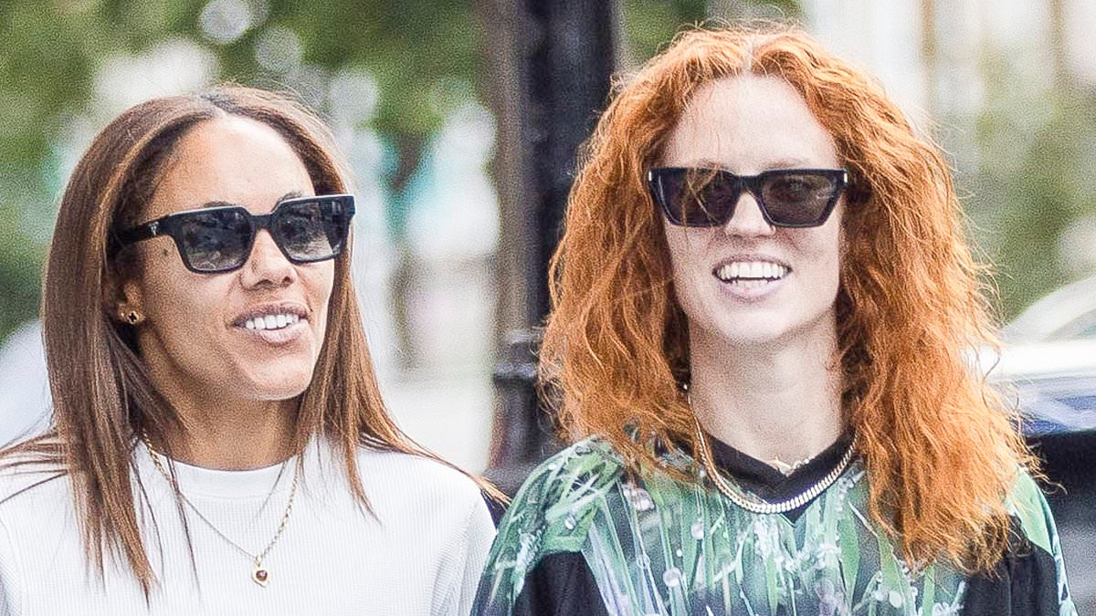 Jess Glynne and Alex Scott look more loved up than ever as they step out hand-in-hand for a stroll around London