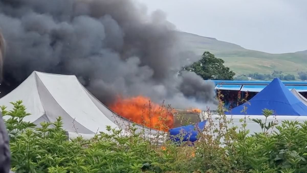 Fire breaks out at Appleby Horse Fair: Stall and tent are engulfed in flames as smoke billows cross gathering of thousands of gypsies from across Europe