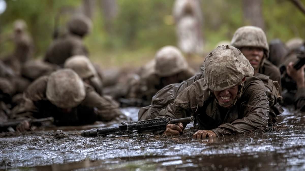 Four hundred rookie Marines made to do gruelling 'mud run' after around a dozen fellow recruits are caught stealing from the camp's self-service canteen