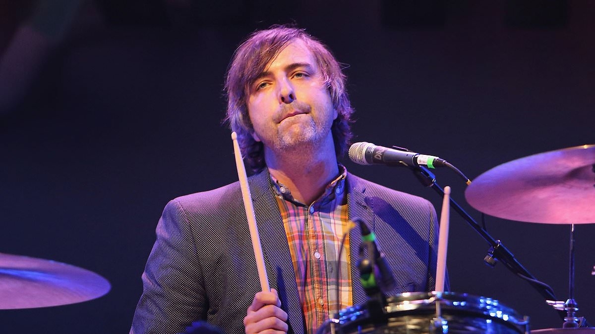Drummer of influential rock band faces sickening new charges in child pornography case