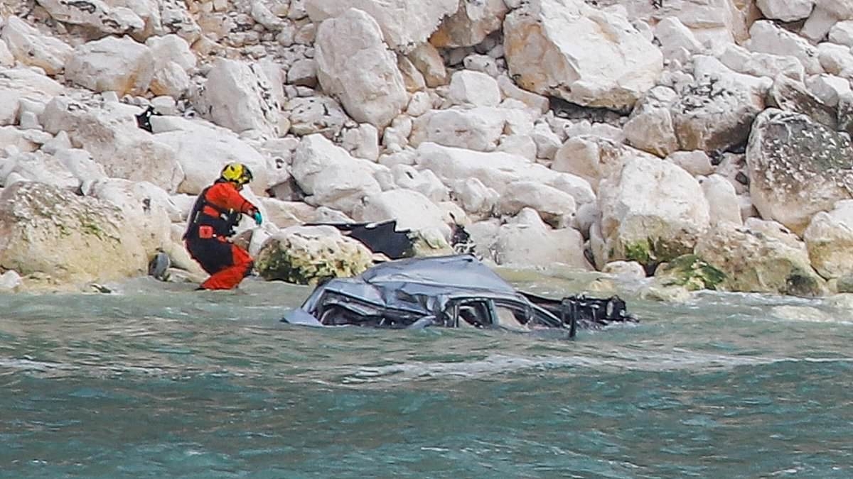 Horror as car plunges off cliff near coastal landmark with man 'recovered' from the water