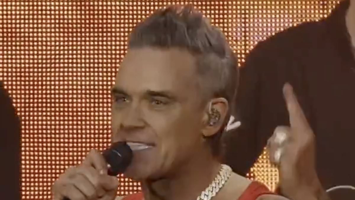 Robbie Williams trolls Arsenal with Tottenham trophy joke while performing at the Emirates Stadium
