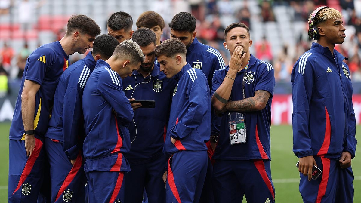 Spain stars huddle around a phone to watch compatriot Carlos Alcaraz's dramatic French Open win over Jannik Sinner ahead of Nations League final