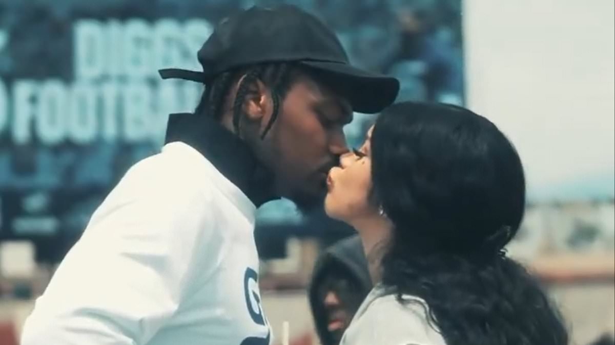 Cardi B and Stefon Diggs pack on the PDA as rapper plays doting girlfriend in surprise appearance at football camp