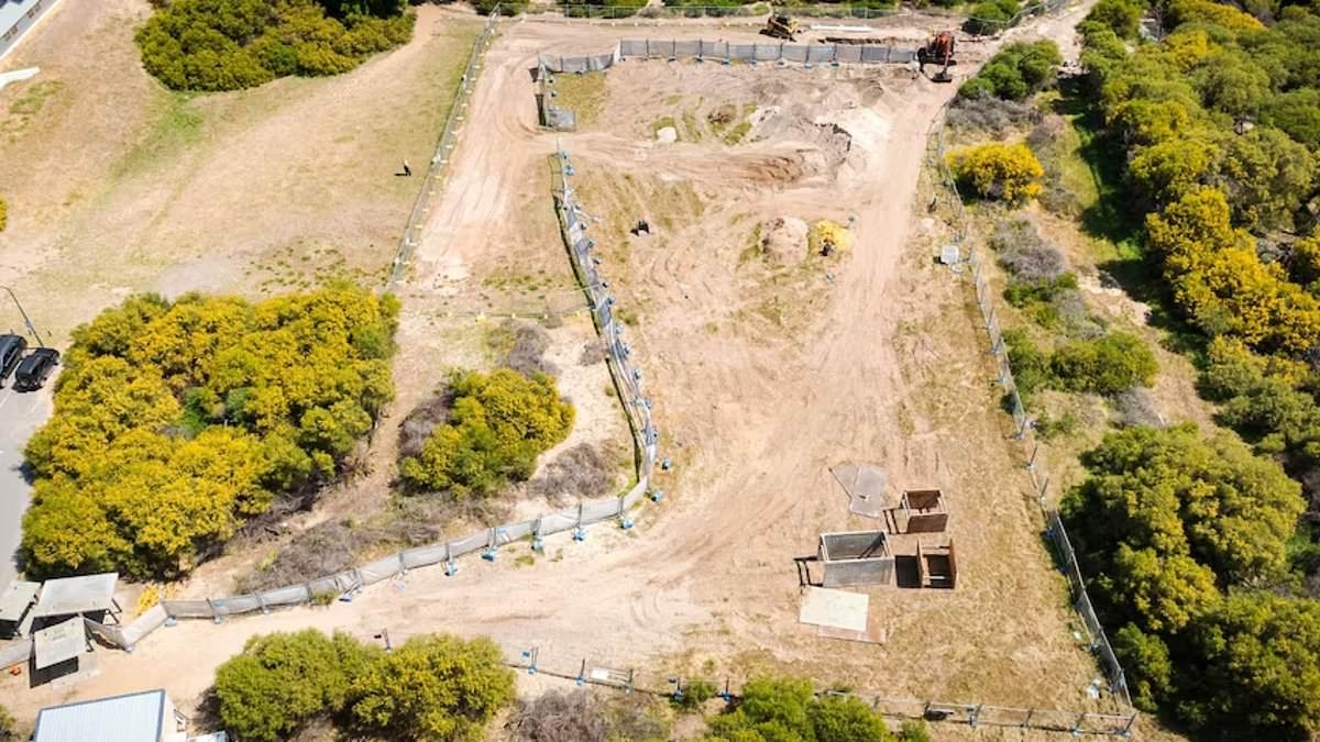 Why a vacant plot of land next to a new children's hospice has sparked outrage as a state politician attempts to take it away from a 'foolish' council
