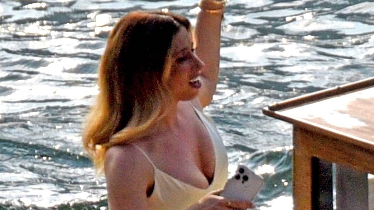 EXCLUSIVE Stacey Solomon is the epitome of elegance in a plunging silk gown as she swaps heels for comfy slippers while filming on Lake Como