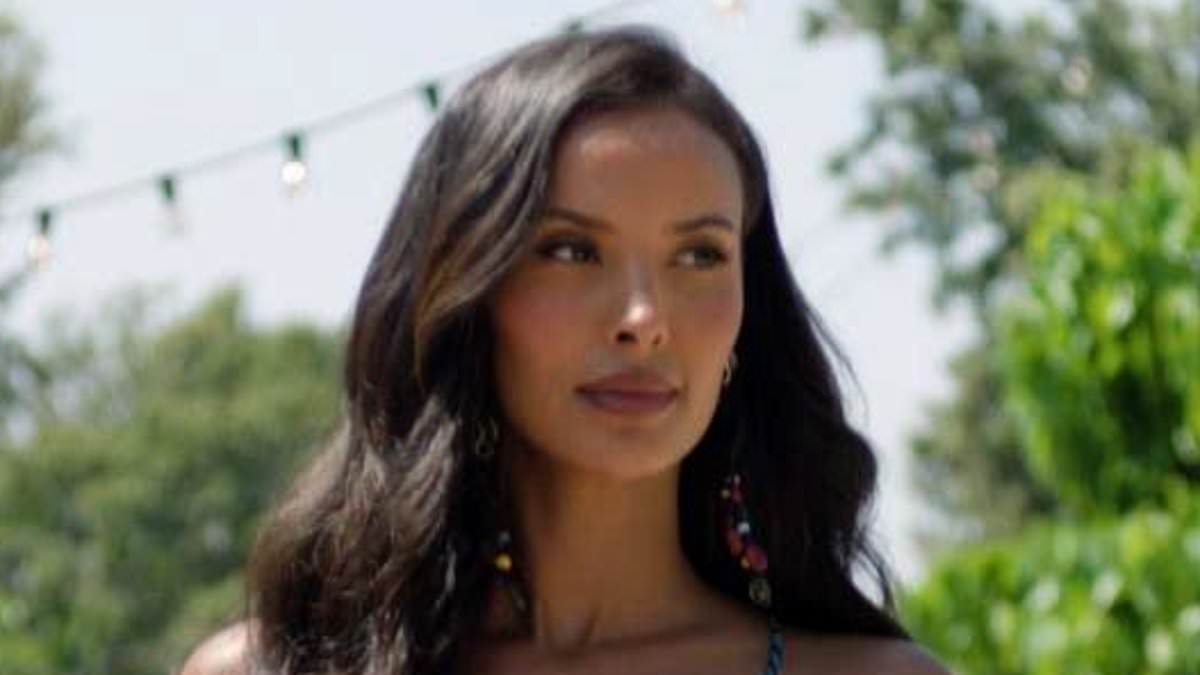 Maya Jama flaunts her eye-popping curves in a plunging floral dress as she makes a showstopping entrance for Love Island launch