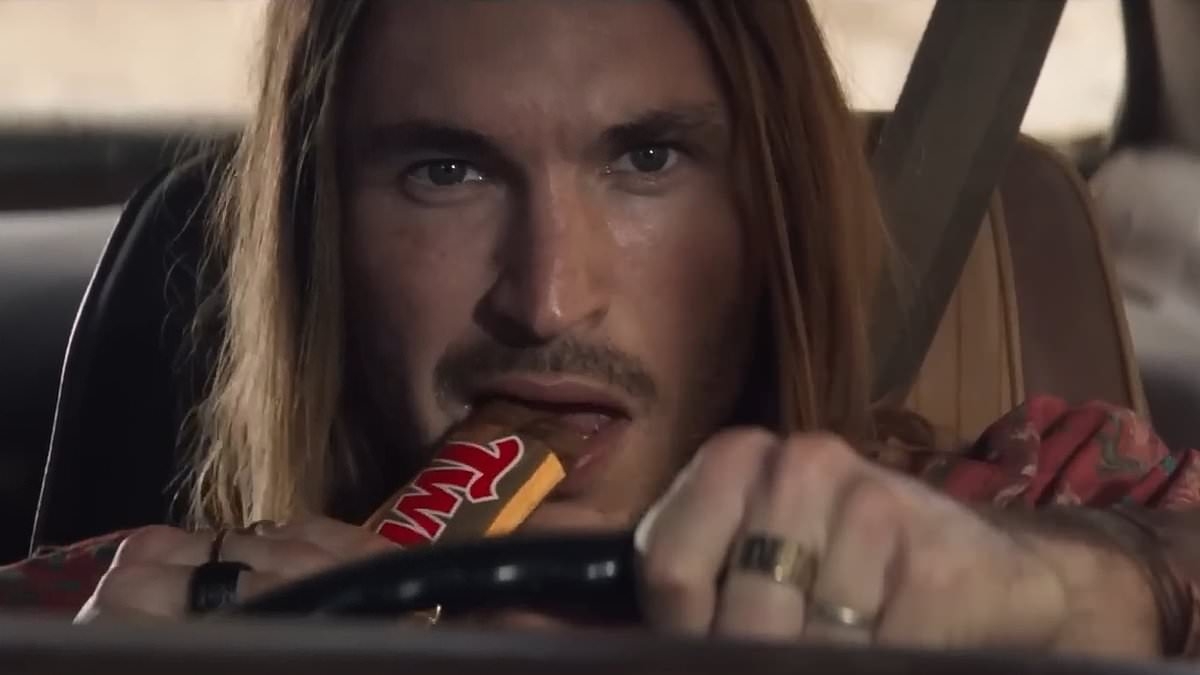 TV Twix advert is BANNED for encouraging dangerous driving - because it shows long-haired driver crashing his caramel-coloured motor on top of another car