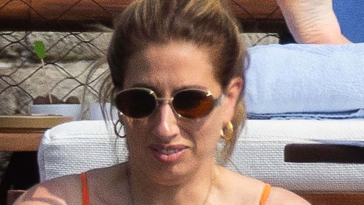 Stacey Solomon soaks up the sun in a skimpy orange bikini as the busy mum of five enjoys a relaxing pool day during Lake Como work trip