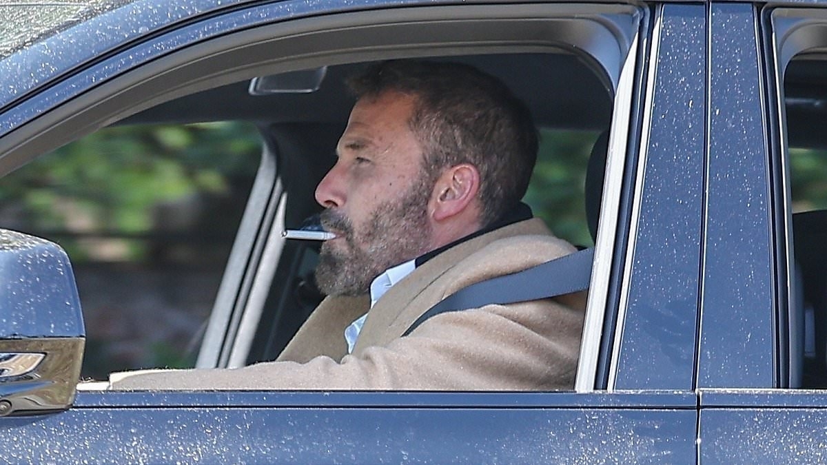 Tense Ben Affleck puffs on a cigarette in his car after extreme move to sever ties with ex-wife Jennifer Lopez