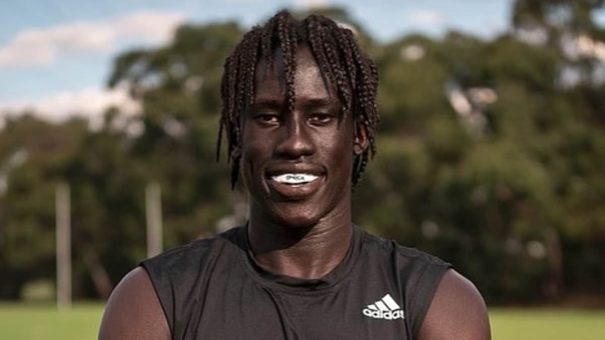 Footy star Changkuoth Jiath reveals he would have either died or became a child soldier if it wasn't for his parents