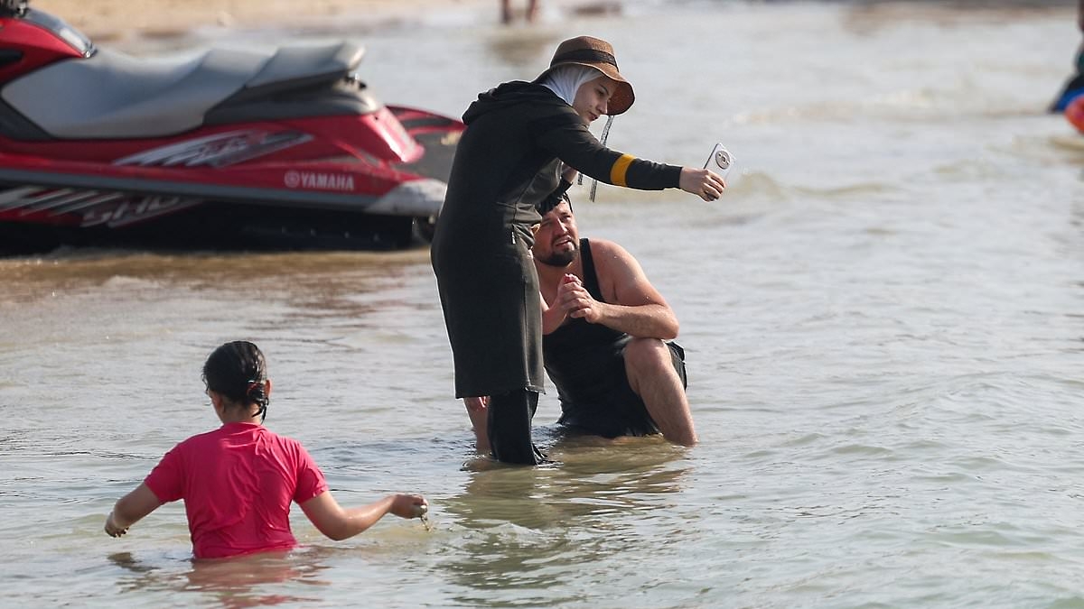 Syria's new Islamist government orders women to wear burkinis at the beach - but bikinis are allowed at 'four star or above' hotels and private beaches