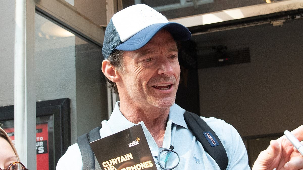 Hugh Jackman looks in good spirits as he's mobbed by fans in New York despite claims ex Deborra-Lee Furness is 'planning to release divorce tell-all'