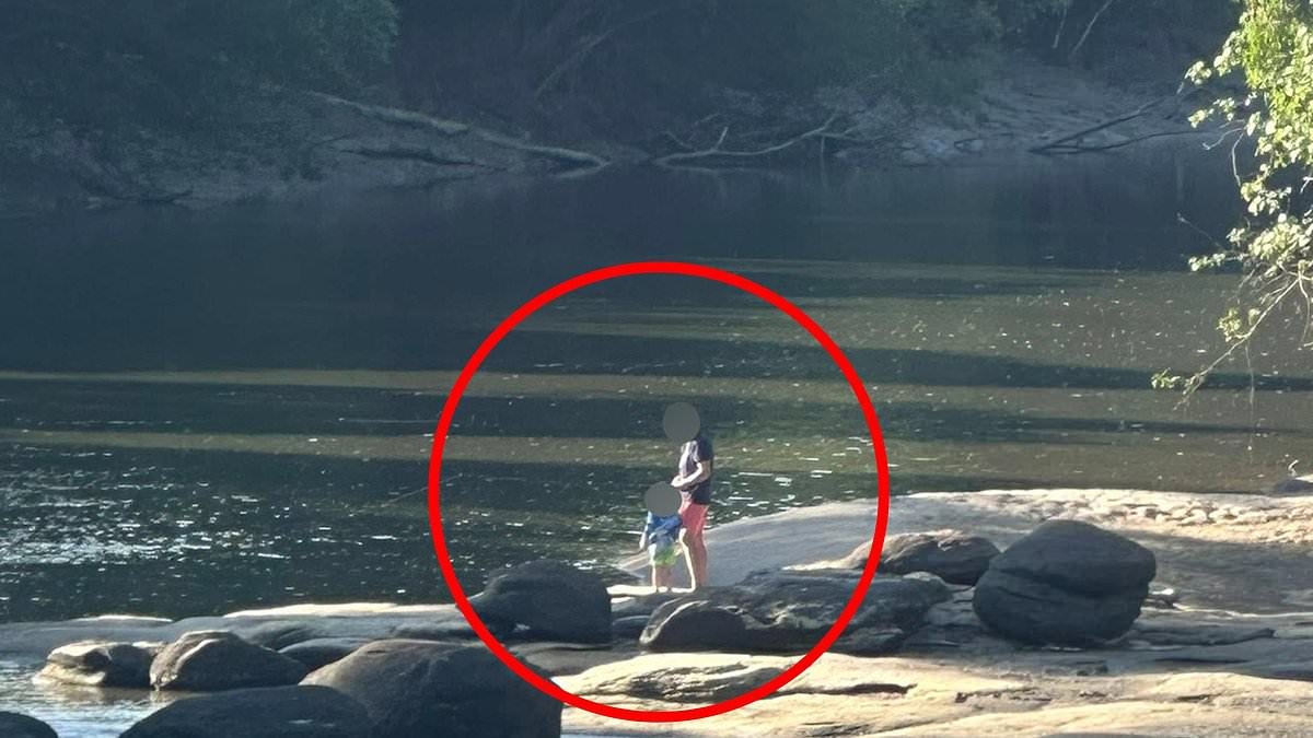 Why this picture of a father and son peacefully fishing on a quiet river has Aussies up in arms
