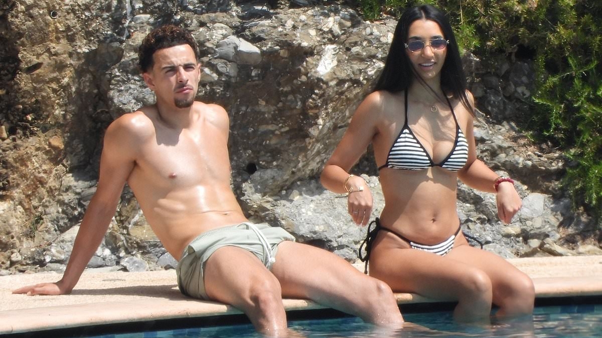 Liverpool star Curtis Jones laps up the sunshine on his holidays with partner Saffie Khan just days after disappointing end to the season with England