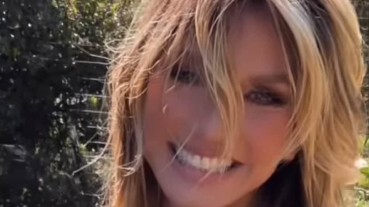 Heidi Klum, 52, leaves little to the imagination in a tiny nude bikini as she tends to her garden in racy video