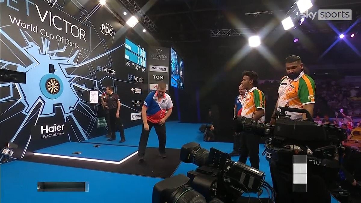 Watch the incredible moment darts star loses a TOOTH while celebrating victory in World Cup match