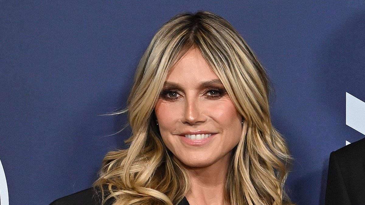 Heidi Klum performs erotic dance with a garden hose in barely there bikini during wild video