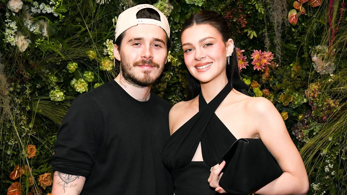 Brooklyn Beckham's friends say they are 'not surprised' he failed to acknowledge David's knighthood - as Victoria and brothers shower father with pride