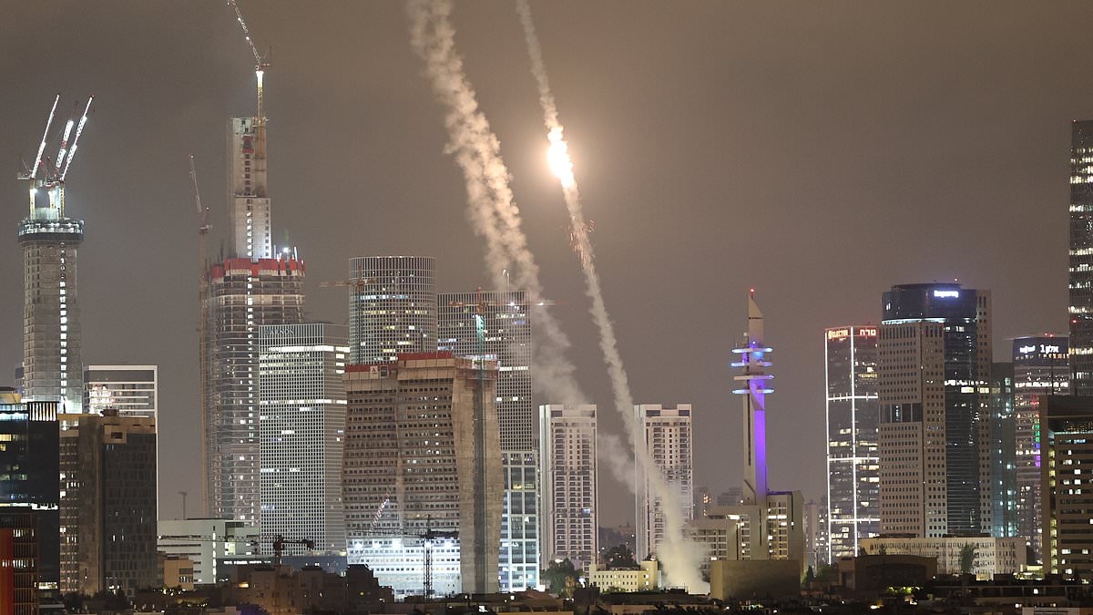BREAKING NEWS Iran sends barrage of missiles showering over Israel with seven feared dead as retaliation strikes hit Tehran oil depot