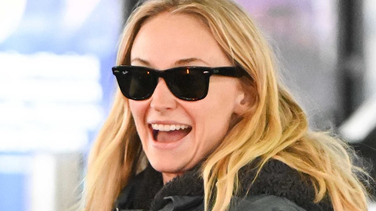 Beaming Sophie Turner flashes her abs in low-rise trousers as she lands in NYC after showing support for her ex-husband Joe Jonas
