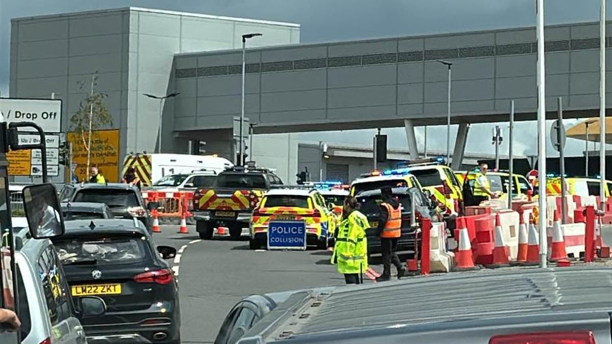 Car plunges off multi-storey car park at Luton Airport: Man is rushed to hospital with 'serious' injuries
