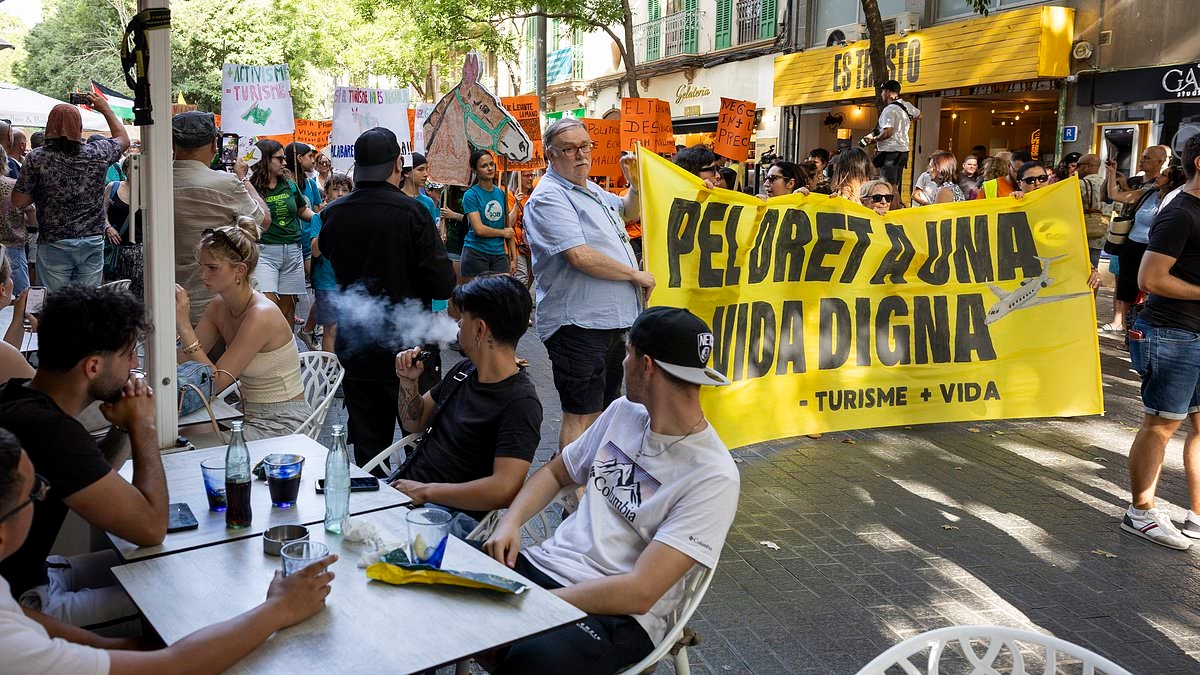 EXCLUSIVE Furious Spaniards demand Brits 'go home' as they march through streets in front of stunned holidaymakers in latest wave of anti-tourist protests