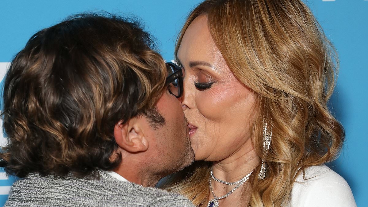 SBS presenter Karla Grant and Married At First Sight star Nasser Sultan enjoy a steamy pash as they pack on the PDA at Sydney Film Festival 2025