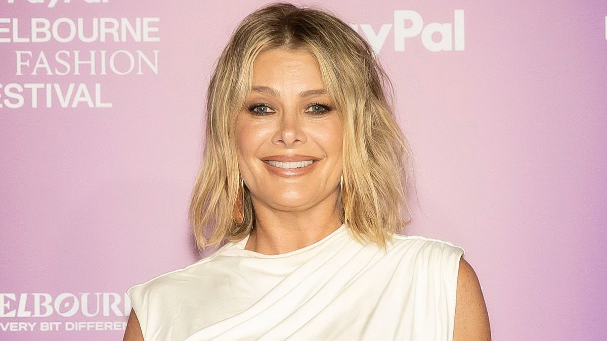 Natalie Bassingthwaighte puts on a busty display as she shows off her very ample cleavage in sexy Pride Festival fit