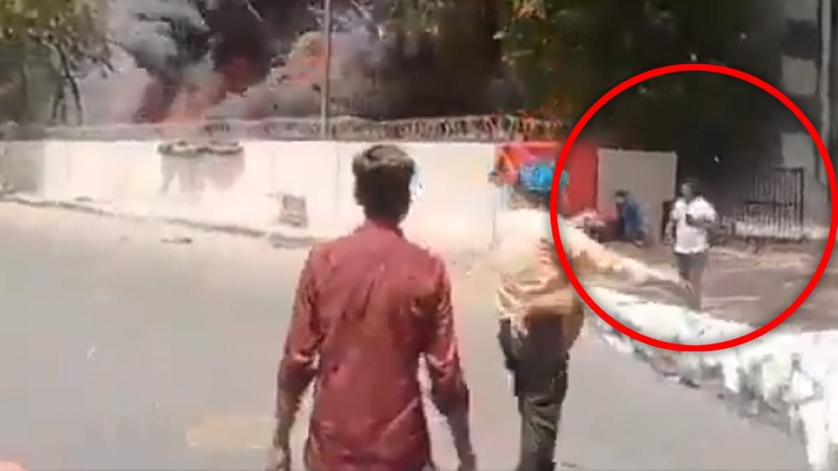 Astonishing new footage shows plane EXPLODE behind British Air India crash survivor as he calmly walks away while talking on his phone
