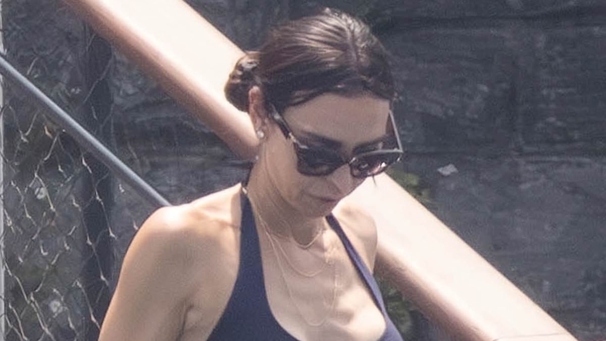 Christine Lampard displays her impressive figure in a navy halterneck bikini as she joins husband Frank on family holiday in Lake Como