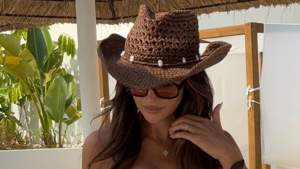 Michelle Keegan stuns in a cut-out swimsuit as she shows off her figure three months after welcoming baby daughter with husband Mark Wright