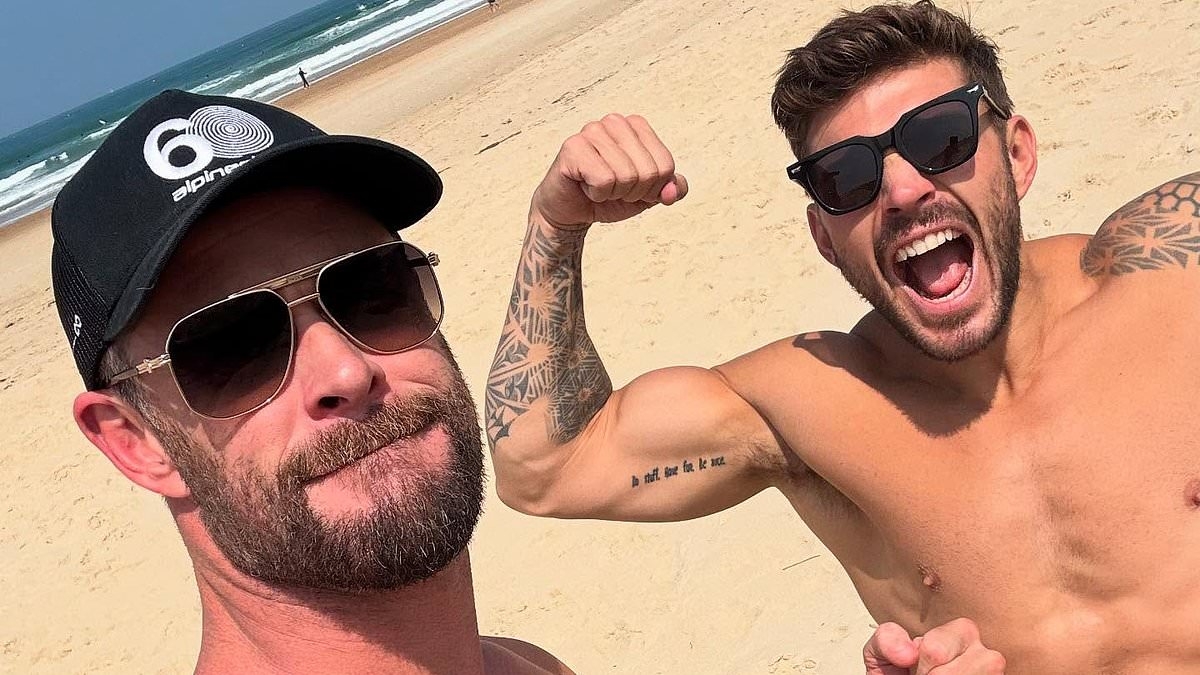 Chris Hemsworth shows off his ripped physique as he enjoys a sun-soaked getaway in France with his parents and trainer Luke Zocchi