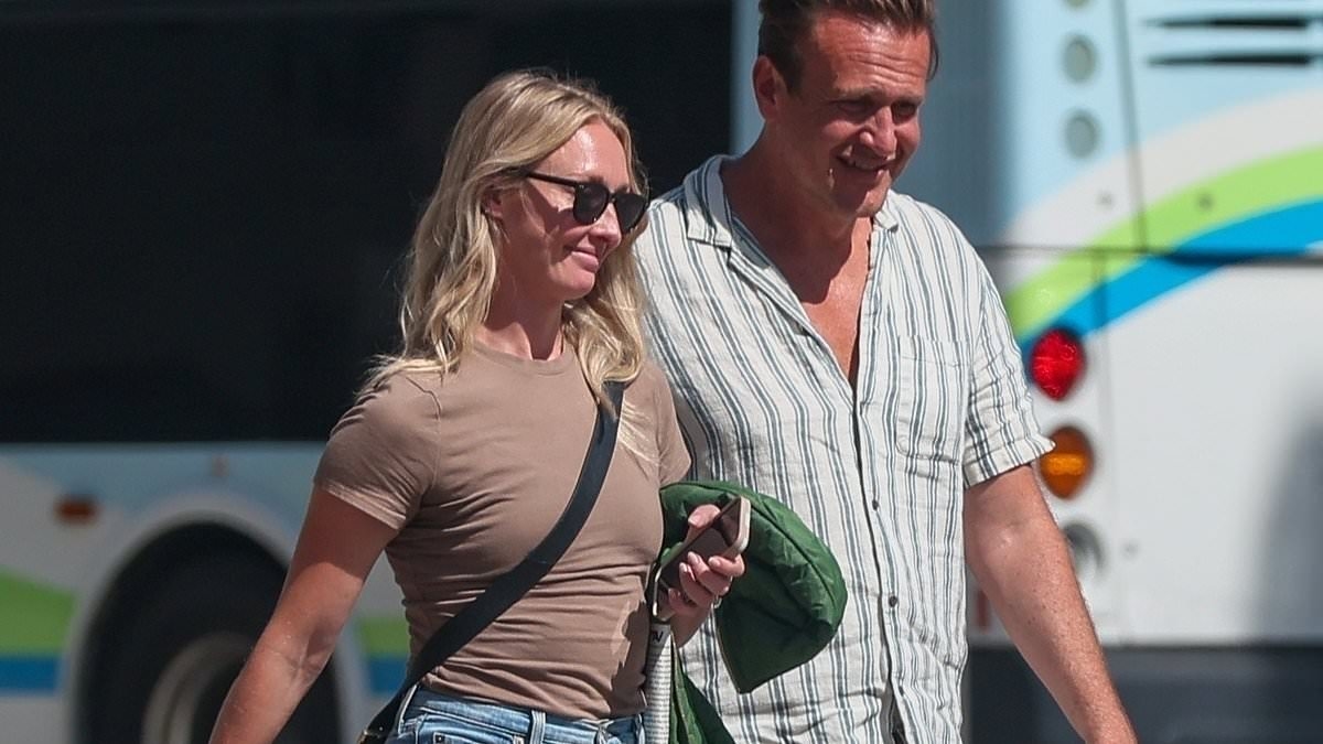 Jason Segel's new fiancee Kayla Radomski flashes giant engagement ring in first sighting since proposal