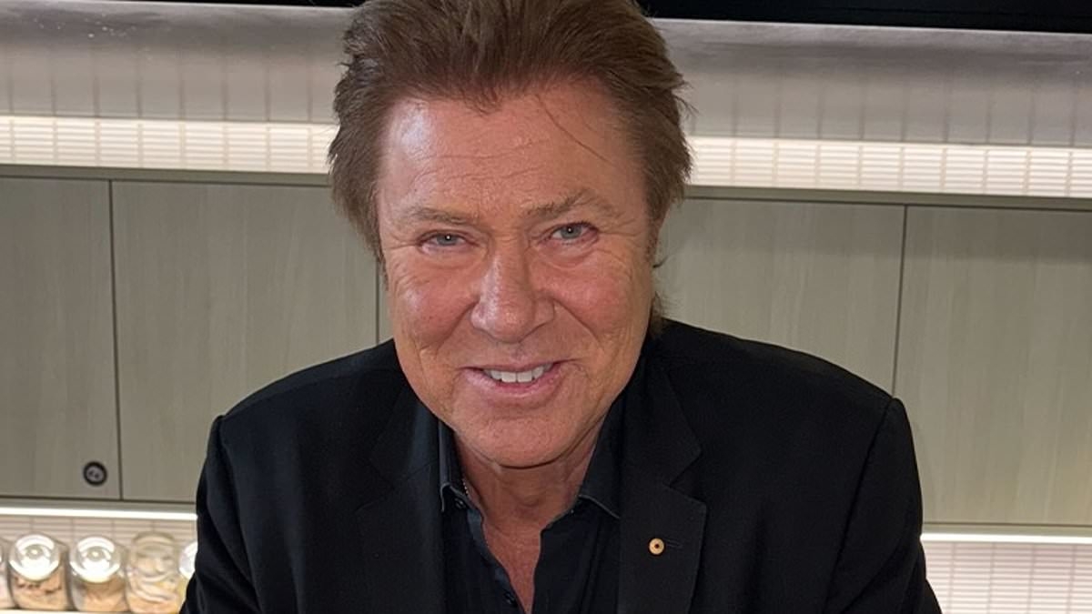 Richard Wilkins celebrates 71st birthday in style with towering $150 chocolate cake adorned with strawberries