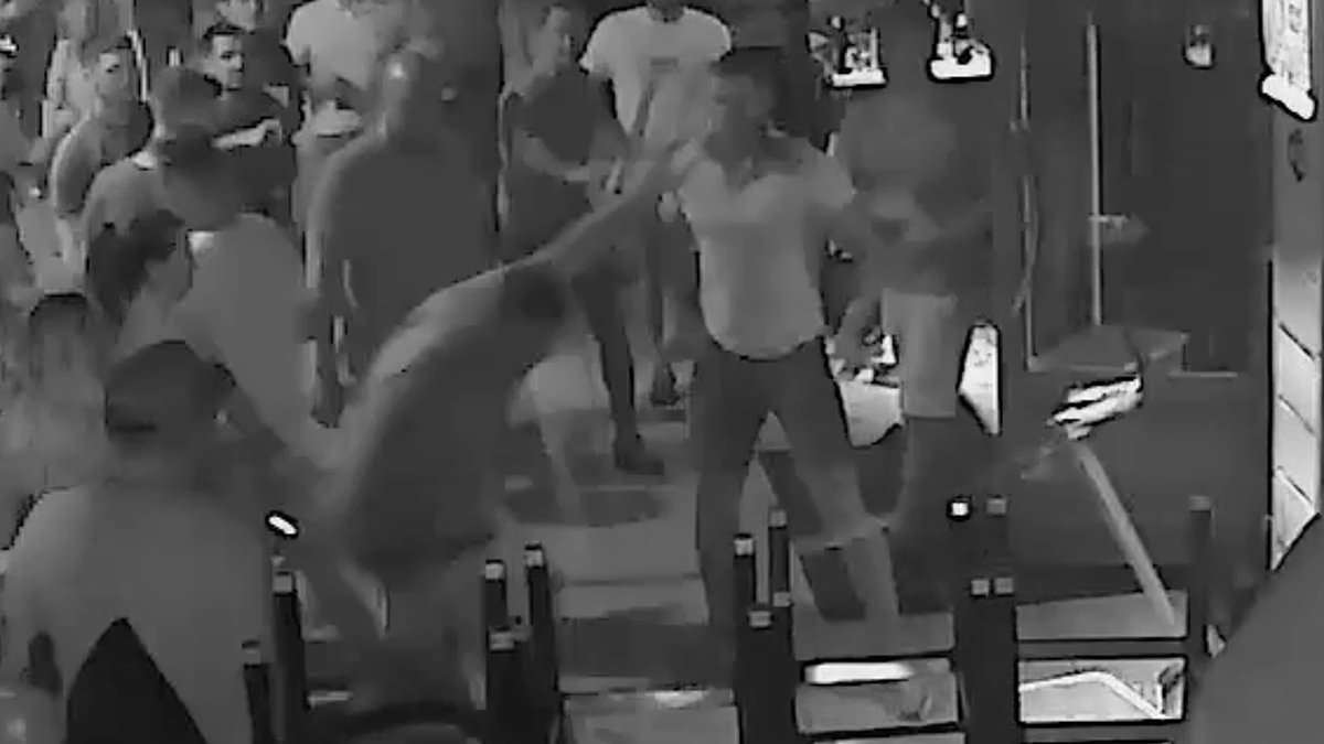 Moment British teenager is punched to the ground by bouncer after smashing a bottle in his face when he was asked to leave Magaluf nightclub