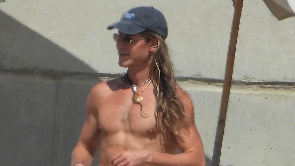 Christian Wilkins steals the spotlight in VERY daring swimwear as he soaks up the sun in Malta during Delta Goodrem's wedding recovery party