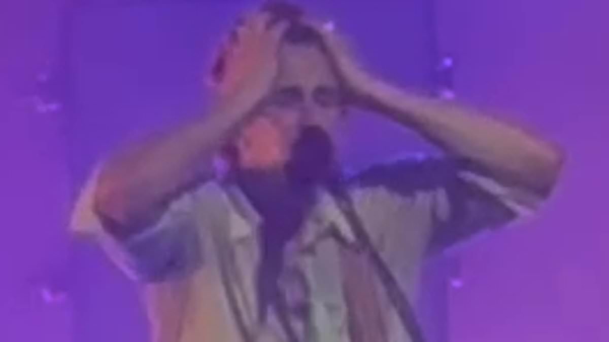 EXCLUSIVE Emotional moment Aussie singer buries his head in his hands while performing iconic track tainted by heartbreaking memory