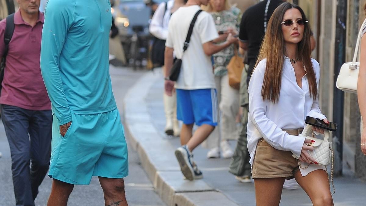 Dele Alli cuts a sporty figure as he steps out for some luxury shopping in Milan with mystery Cindy Kimberly lookalike - just weeks after they split