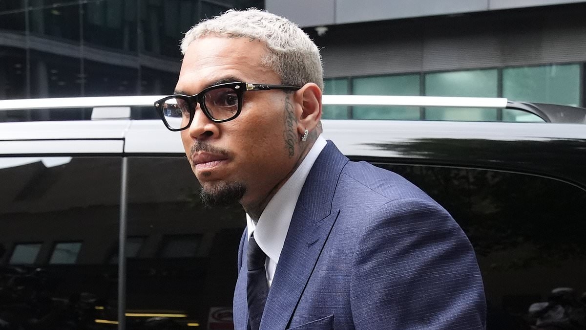 Chris Brown arrives in court to enter a plea on alleged bottle attack at a London nightclub two years ago