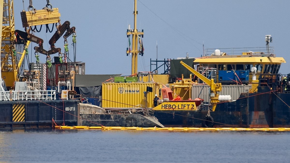 BREAKING NEWS Moment Mike Lynch's Bayesian superyacht is raised from the seabed ten months after it sank killing tycoon and six others off Sicily