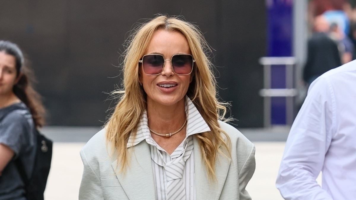 Amanda Holden ditches her trousers and struts out of Heart FM in an oversized shirt as she attempts to keep cool in the heatwave