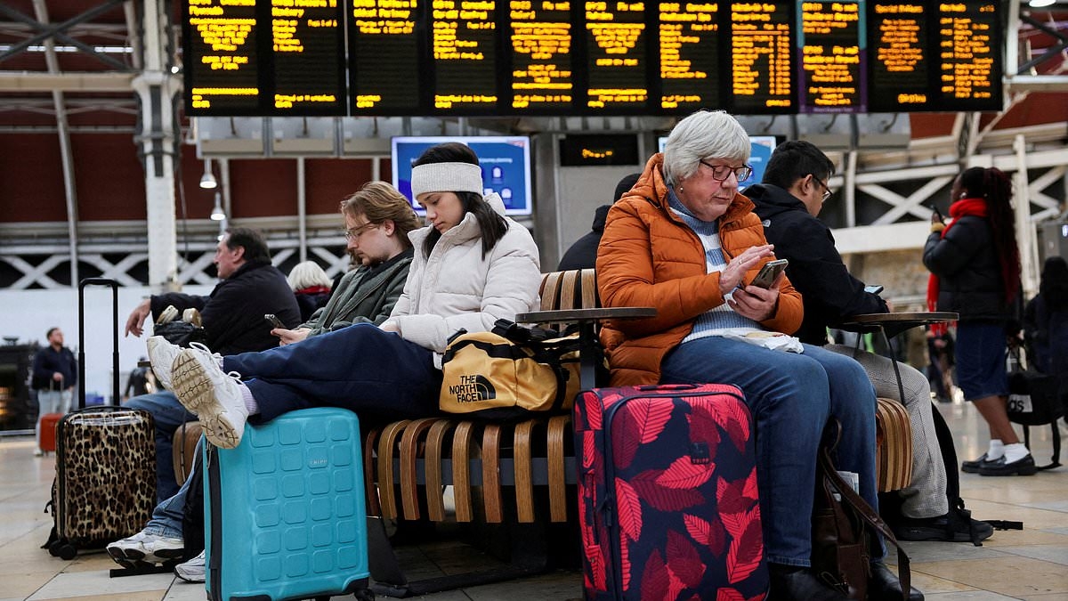 Rush hour commuters face massive disruption at one of Britain's busiest railway stations as blaze breaks out beside track