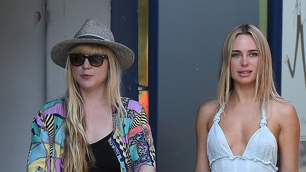 Kimberley Garner puts on a leggy display in a frilled summer mini dress as she enoys sweet meet-up with her friend Bella Franks and her baby