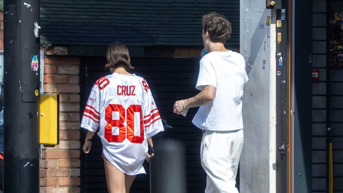 Jackie Apostel, 30, makes touching tribute to boyfriend Cruz Beckham as she wears a jersey with his name on while joining his family at his gig - amid ongoing feud with Brooklyn
