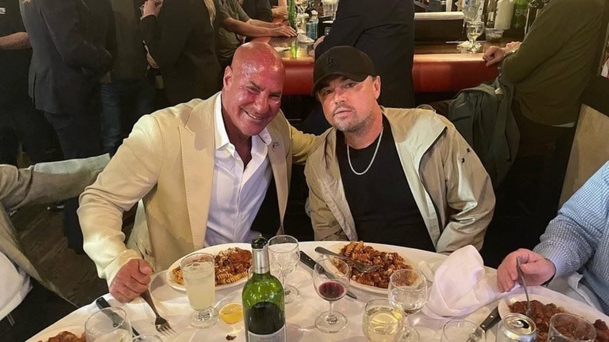 Leonardo DiCaprio gets cozy with NYC's power crowd while dining at city's most exclusive restaurant