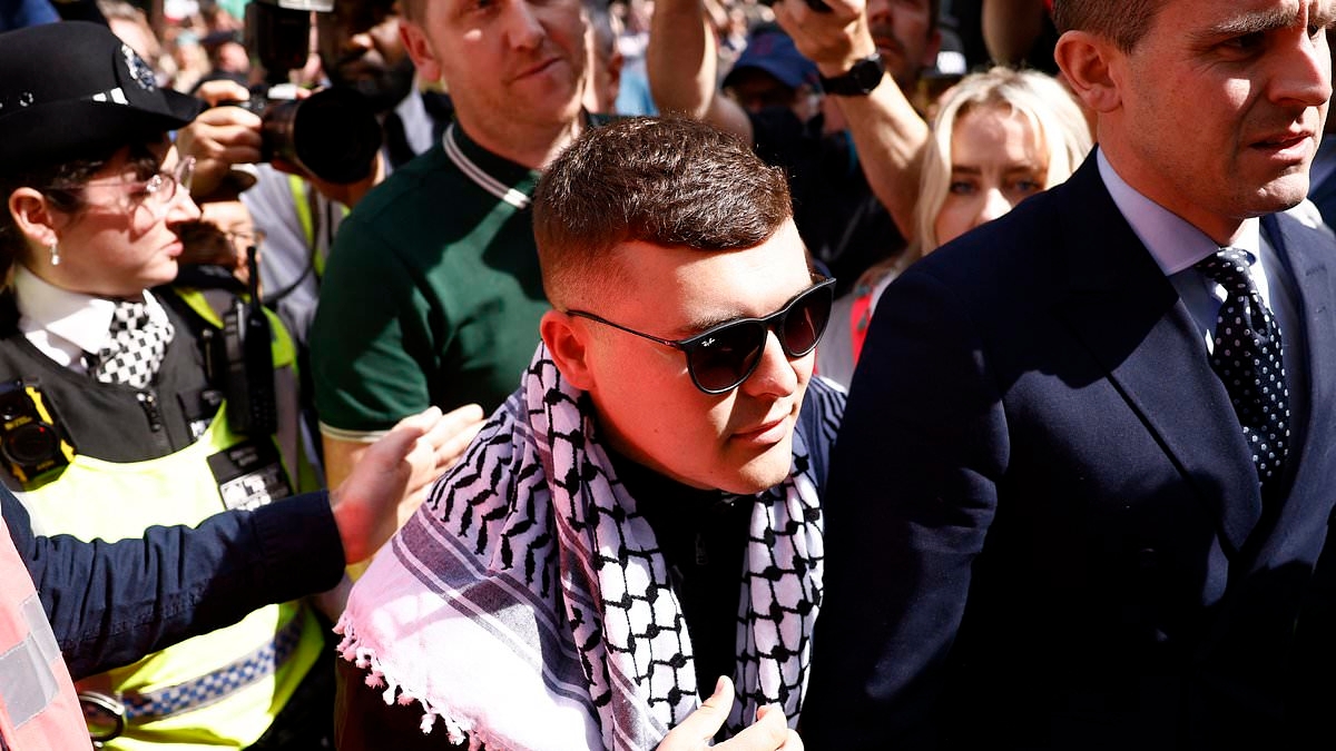 BBC must not show Kneecap at Glastonbury says Kemi Badenoch after member of Irish rap group was charged with carrying Hezbollah flag