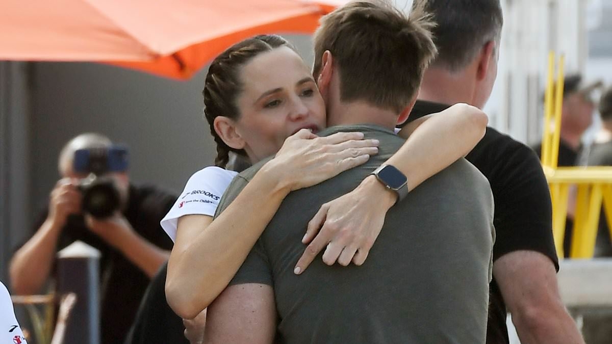 Jennifer Garner shares an intimate moment with boyfriend John Miller as he sweetly supports her running event